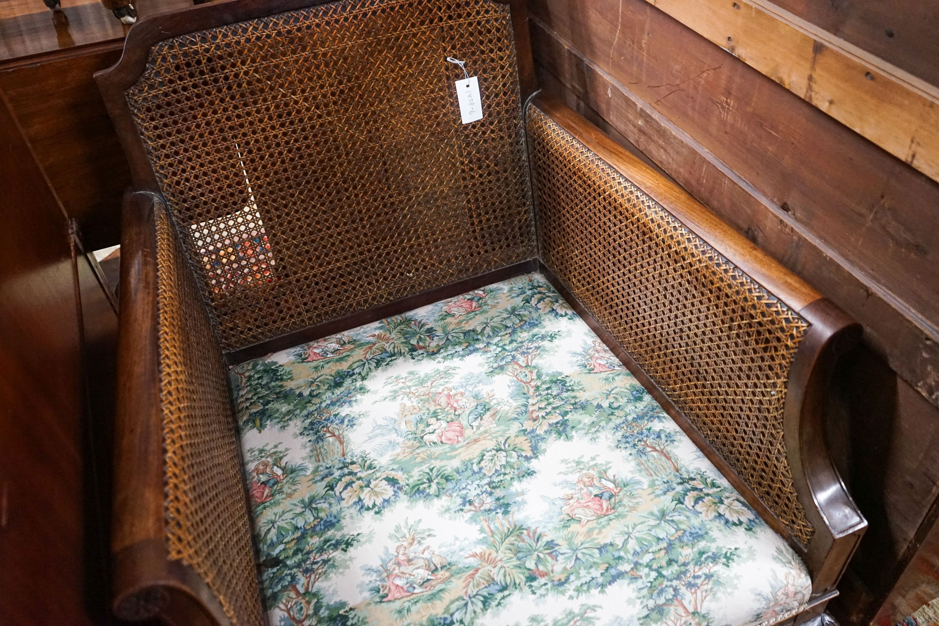 A 1920's mahogany single caned bergere armchair, width 75cm, depth 80cm, height 80cm